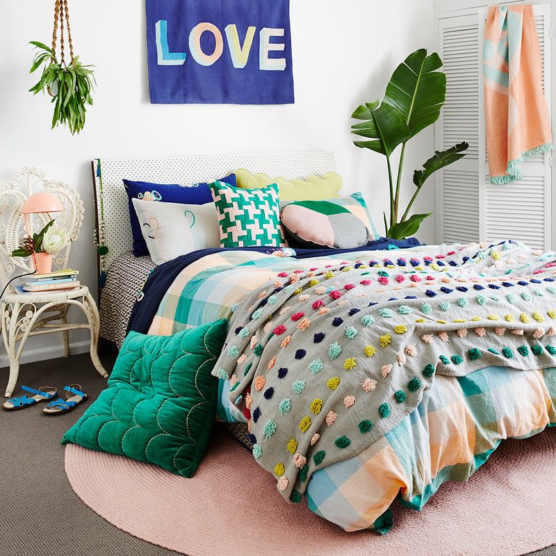 This season’s key colours of emerald, turquoise, coral and blush have been woven to create this large scale check quilt cover with a textural hand feel